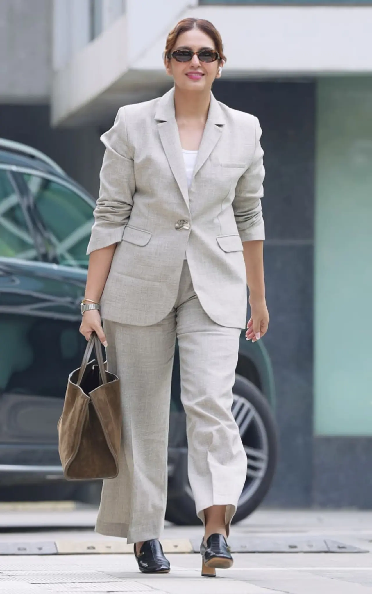 Huma Qureshi stepped out in the city in formal and powerful look, wearing a beige pantsuit.